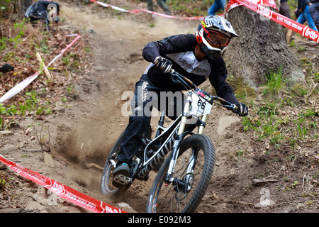Rider going down in the dust. Down Hill mountain biking race in Chaudfontaine in Belgium, National championship. Stock Photo