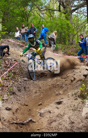 Rider going down in the dust. Down Hill mountain biking race in Chaudfontaine in Belgium, National championship. Stock Photo