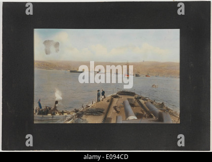 This photograph from October 7, 1914, captures workers painting the suspension cables of the ...
