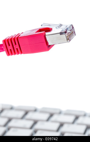 Network cable on keyboard, symbolic photo fue Flatrate, e-commerce, global communication, Netzwerkkabel auf Tastatur, Symbolfoto Stock Photo