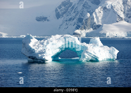 arched iceberg in wilhelmina bay Antarctica Stock Photo