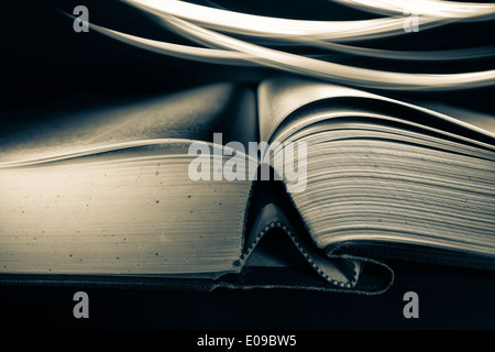 Open hardcover book with light effects Stock Photo