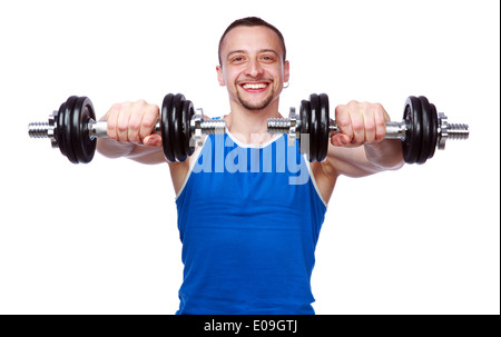 Smiling sports man working out with dumbbells on white background Stock Photo