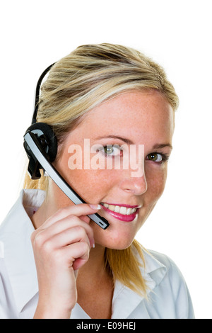 Young woman with Headset calls up in the Bueo with order acceptance. Hotline and customer service., Junge Frau mit Headset telef Stock Photo