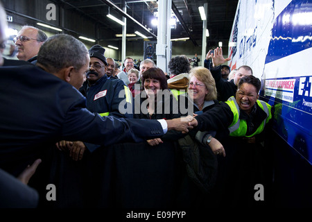 US President Barack Obama greets audience members after he delivers remarks on improving the fuel efficiency of American trucks, at the Safeway Distribution Center February 18, 2014 in Upper Marlboro, Maryland. Stock Photo