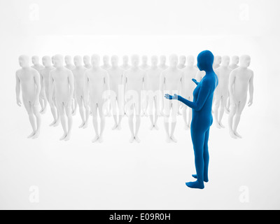 woman dressed in blue full body suit trains an army of white men Stock Photo