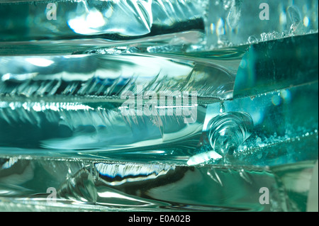 Sharp dangerous edge of plate glass internal reflection brings out green color and depth Stock Photo