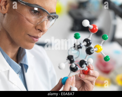 Scientist viewing a molecular structure in a laboratory Stock Photo