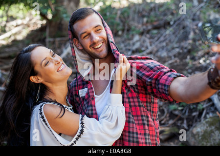 Young couple fooling around in forest Stock Photo