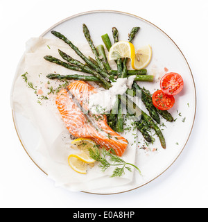 Grilled salmon with asparagus isolated on white background Stock Photo