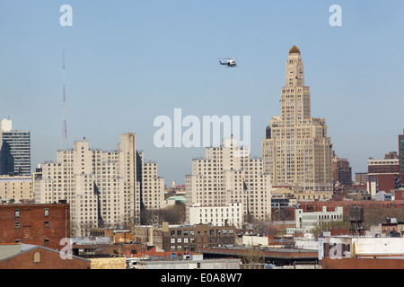 NYPD police helicopter on patrol near downtown Brooklyn, New York City. Stock Photo
