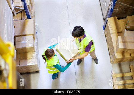 Overhead view of workers in distribution warehouse Stock Photo