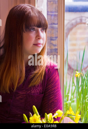 Portrait of girl by window Stock Photo