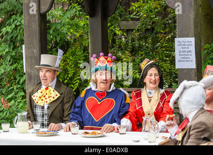 UK, Telford, England 21st July 2012. Actors performing, The mad hatters tea party outdoors, Blists Hill Victorian Town Stock Photo