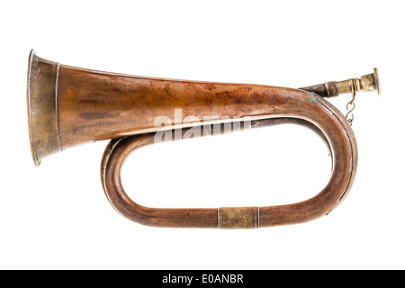 an old and rusty bugle isolated over a white background Stock Photo