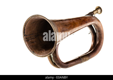 an old and rusty bugle isolated over a white background Stock Photo