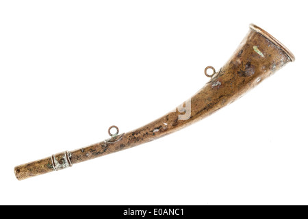 an old and rusty hunting horn isolated over a white background Stock Photo