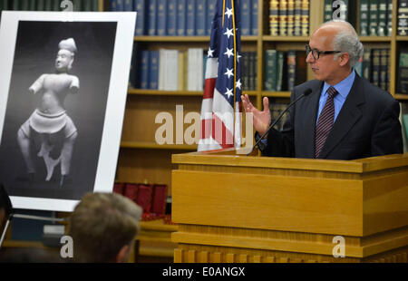 (140508) -- NEW YORK, May 8, 2014 (Xinhua) -- George Papagiannis, UNESCO External Relations to the U.S., speaks at a handover ceremony of the ancient statue of Duryodhana in New York, the United States, May 7, 2014. The Duryodhana, a 10th Century sandstone sculpture, which alleged to be stolen from the Prasat Chen temple at Koh Ker by an organized looting network, and ultimately imported into U.S. for sale by Sotheby's Inc. In April 2012, the U.S. Attorney filed a court action in Federal Court seeking forfeiture of the statue and handing back to Cambodia. In December 2013, Sotheby's decided t Stock Photo