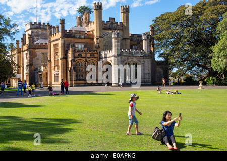Sydney Australia,New South Wales,Royal Botanic Gardens,Government House,Gothic revival style,Victorian Architecture,lawn,Asian Asians ethnic immigrant Stock Photo