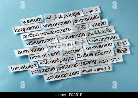 welcome Word Cloud printed on paper on blue  Stock Photo