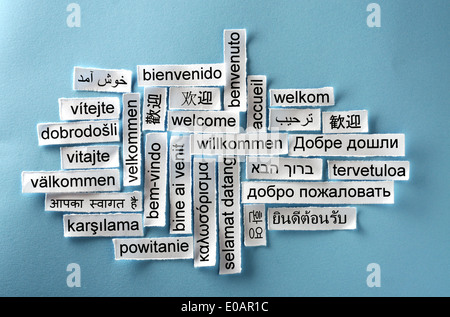 welcome Word Cloud printed on paper on blue  Stock Photo