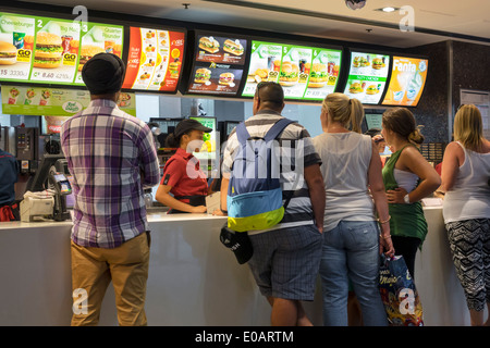 Sydney Australia,Circular Quay,McDonald's,burgers,hamburgers,restaurant restaurants food dining cafe,fast food,counter,ordering,Black woman female wom Stock Photo