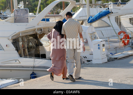 Tunisia, young couple takes a walk in the tourist port of Sidi Bou Said Stock Photo