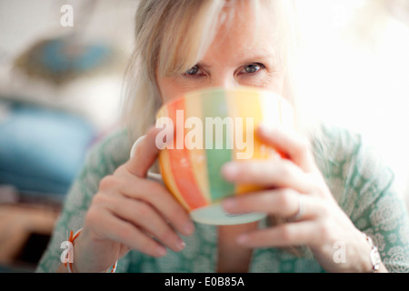 Close up of mature woman drinking coffee Stock Photo
