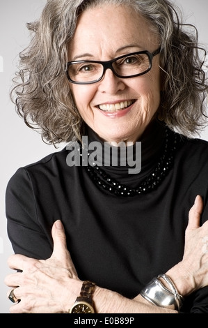 Portrait of senior woman, arms folded