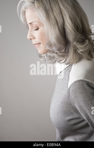 Side view of mature woman with eyes closed Stock Photo - Alamy