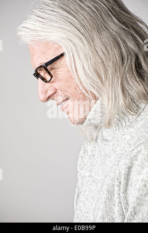 Portrait of mature man, side view, looking down Stock Photo