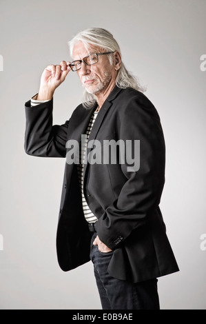 Portrait of mature man, hand in pocket Stock Photo