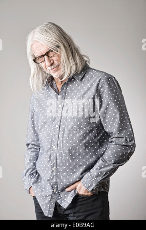 Portrait of mature man, hand in pocket Stock Photo