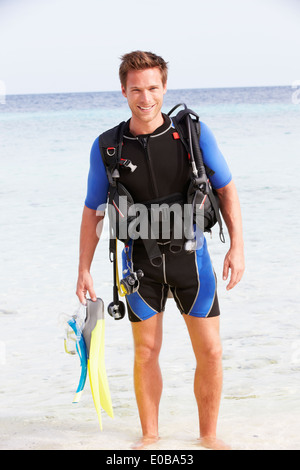 Man With Scuba Diving Equipment Enjoying Beach Holiday Stock Photo