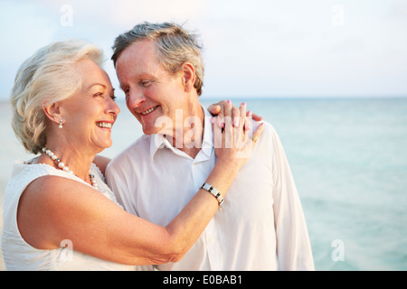 Senior Couple Getting Married In Beach Ceremony Stock Photo
