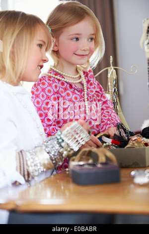 Two Girls Playing With Jewelry And Make Up Stock Photo