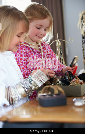 Two Girls Playing With Jewelry And Make Up Stock Photo