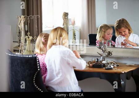 Two Girls Playing With Jewelry And Make Up Stock Photo