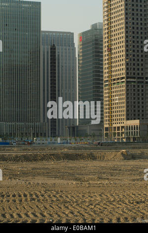 TIANJIN, China. 05-MAY-2014. The unfinished office and residential tower blocks of the New Yujiapu Financial district, part of the Binhai New Development Area stand eerily empty. According to Nomura analysts, China's property bubble has burst, and the country's economy could slow dramatically unless Beijing steps in with new stimulus measures. © Olli Geibel Stock Photo