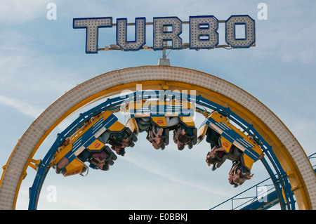 Passengers upside down on the Turbo coaster ride . Brighton pier   Brighton   Sussex UK Stock Photo