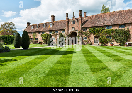 Sissinghurst Castle, Kent. The Front Courtyard and entrance gate - the Long Library is on the right with the Main House opposite Stock Photo