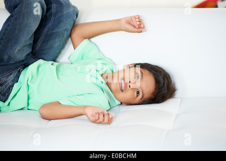Boy Playing On Sofa Stock Photo