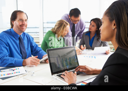 Businesspeople Meeting In Boardroom Stock Photo
