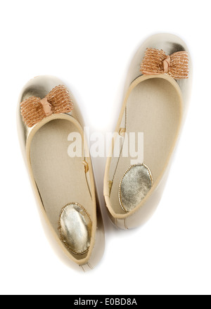 Gold ballet shoes for women. View from above. Isolate on white. Stock Photo