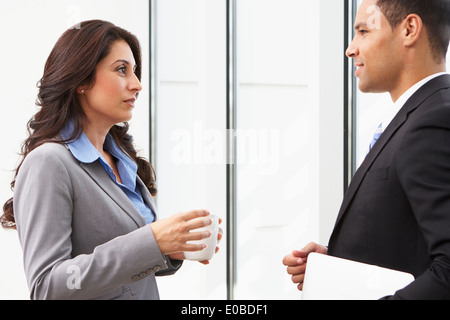 Businesspeople Having Informal Meeting In Office Stock Photo
