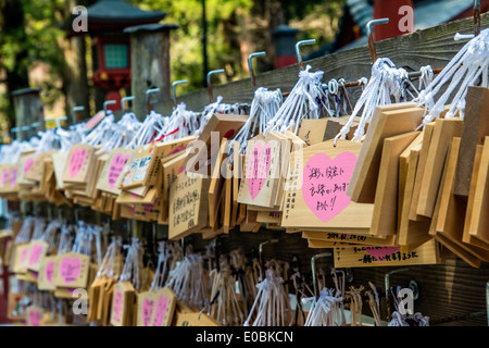 Ema prayer sor wishes wooden plaques hanging from a rack, Taiyuin-byo Temple, Nikko, Tochigi Prefecture, Japan Stock Photo