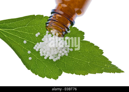 Globuli to the treatment of illnesses in the gentle, alternative medicine. Tablets and drugs Stock Photo