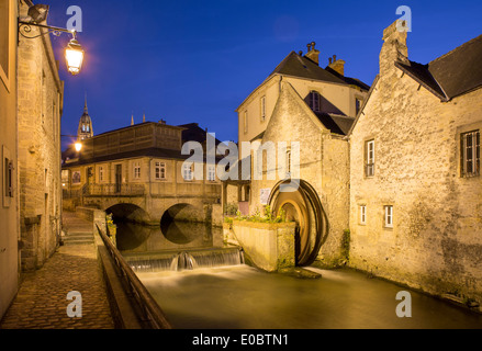 Dusk view over the mill along River Weir and medieval town of Bayeux, Normandy France Stock Photo