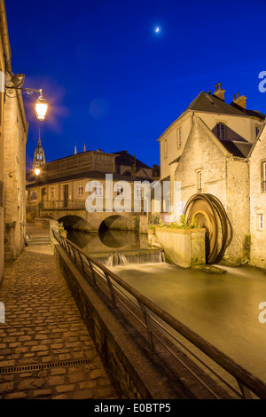 Dusk view over the mill along River Weir and medieval town of Bayeux, Normandy France Stock Photo