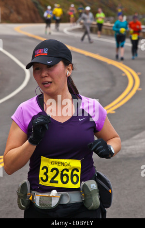 Runners on Highway 1 participate in the 2014 Big Sur Marathon - BIG SUR, CALIFORNIA Stock Photo